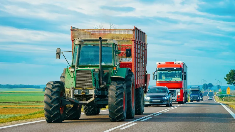 Agricultural tractor at the highway road