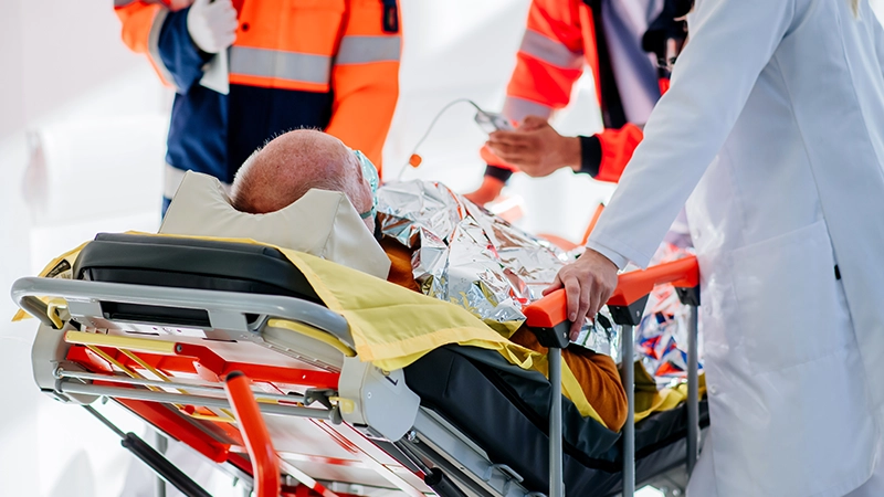 Doctor taking care of patient from rescue ambulance.