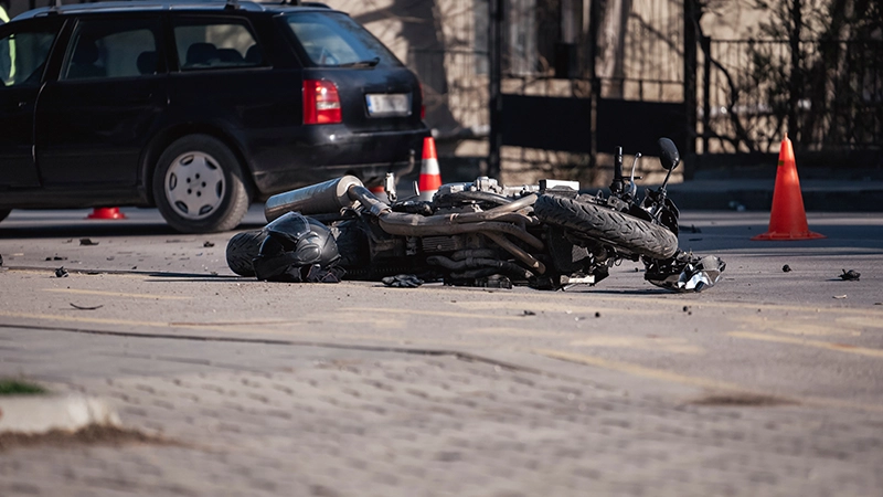 Accident with motorcycle at a crossroads.