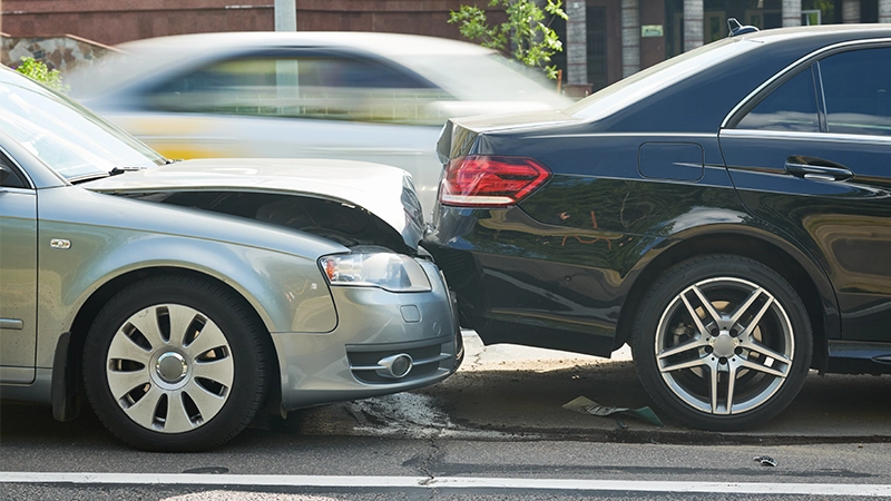 Car crash accident on street, damaged automobile.